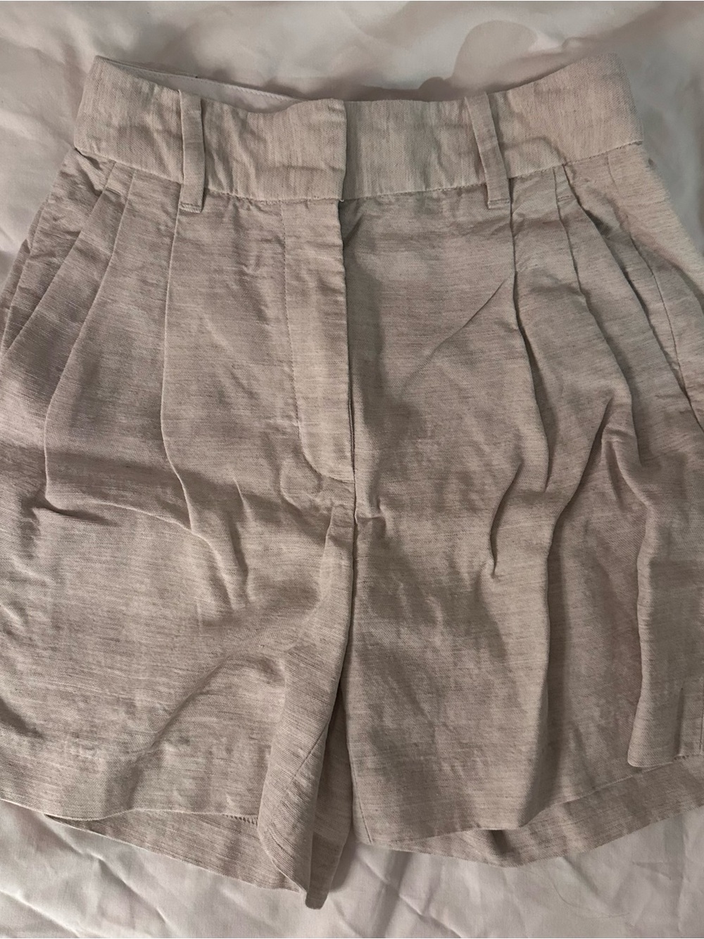 Aritzia High-Waist Pleated Shorts in Light Beige